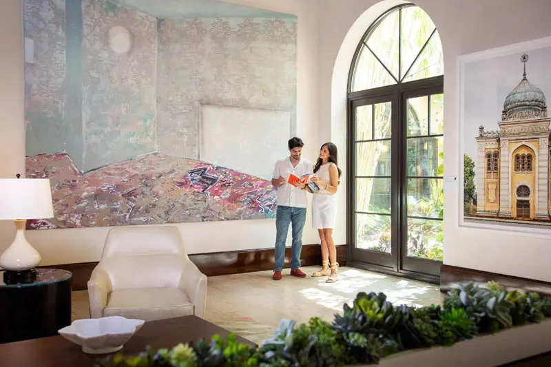 The Alfond Inn Lifestyle Couple Art Lobby Sunlit Interior Photography by Greg Ceo Studio Retouching by Valentin Sivyakov