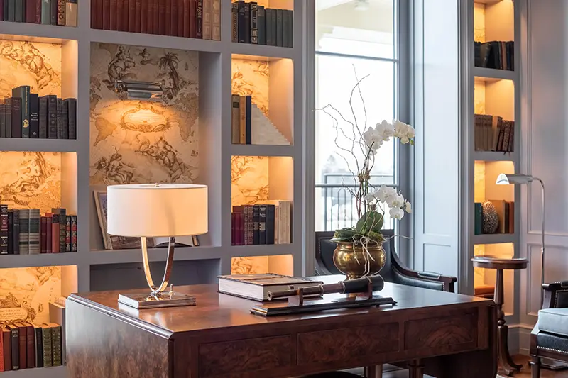 Keswick Hall Keswick Hall Library Detail Illuminated Bookshelves Antique Desk Elegant Decor Keswick Virginia Luxury Resort Photography Greg Ceo Studio Retouching by Valentin Sivyakov