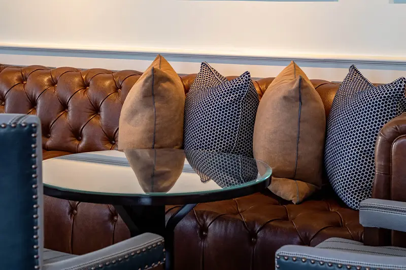 Keswick Hall Keswick Hall Lounge Seating Detail Leather Banquette Butterfly Artwork Keswick Virginia Luxury Resort Photography Greg Ceo Studio Retouching by Valentin Sivyakov